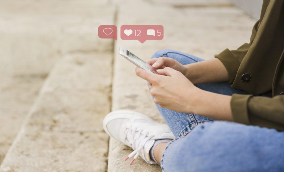 close-up-woman-sitting-stairs-using-social-media-app-mobile